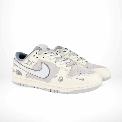 Angled front view of a full pair of Nike SB Dunk Low