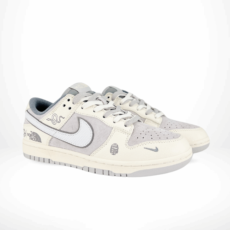 Angled front view of a full pair of Nike SB Dunk Low