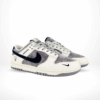 Angled front view of a full pair of Nike SB Dunk Low